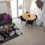 Spacious living area with brand-new furniture and stylish interior decor in a renovated home in Guia.